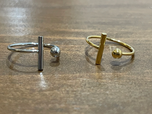 A tarnish-resistant, waterproof ball and t bar ring available in gold and silver at bubs & sass.