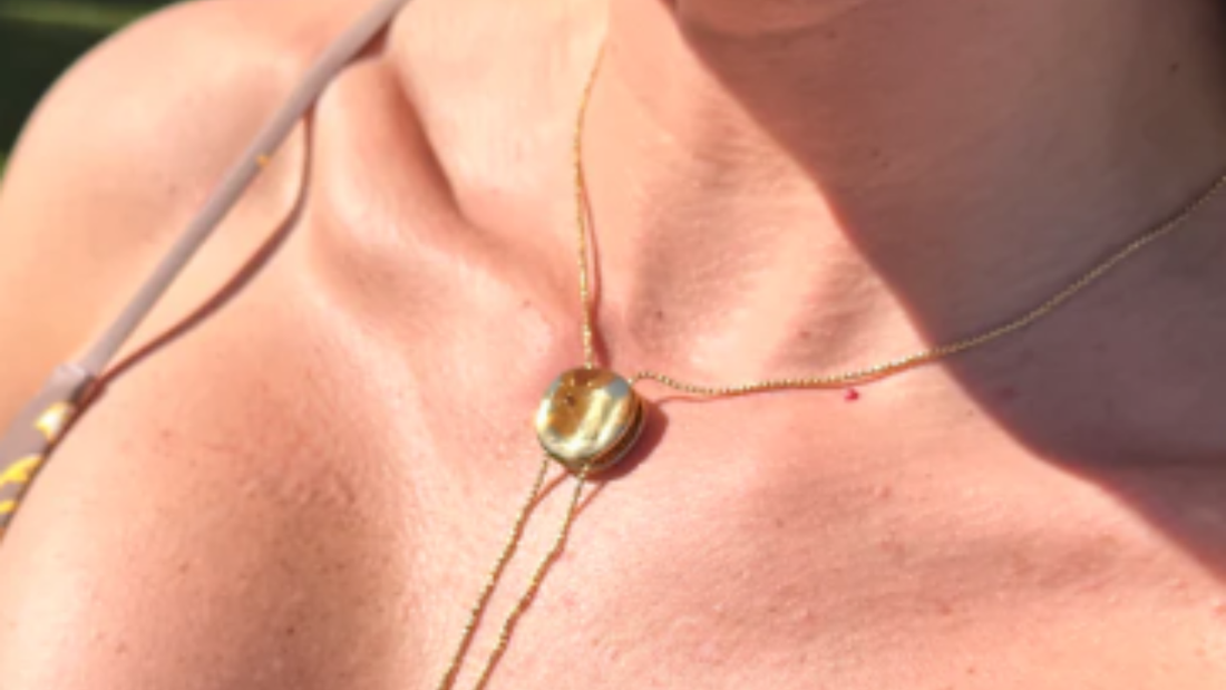 Gold disc drop lariat available at bubs & sass.