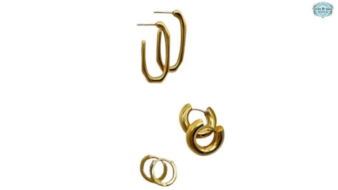 Three pairs of gold hoop earrings displayed on a neutral background, showcasing different sizes and styles. 